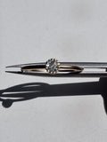 18ct gold-plated sterling silver ring with a single light blue  topaz in a crown setting