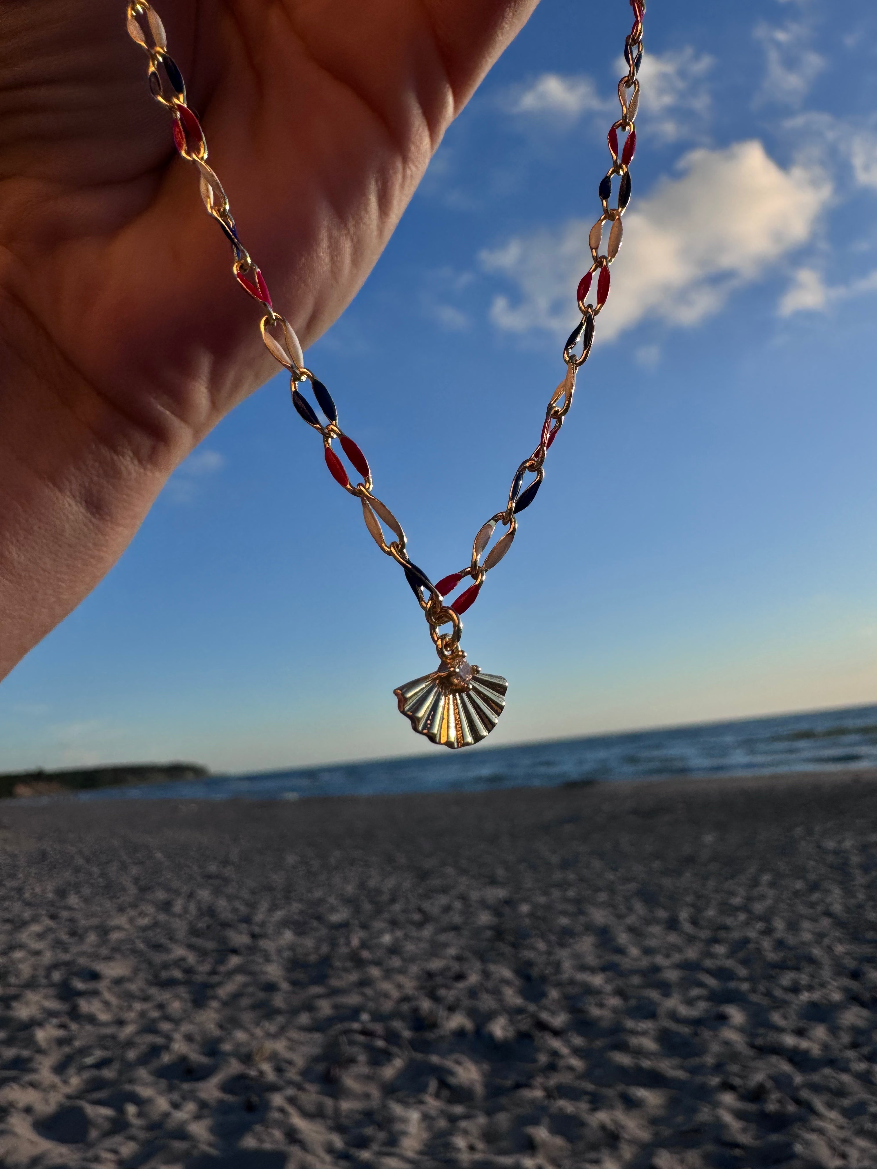 Gold-finish sterling silver necklace with red, white and blue enamel beads and a gold fan charm