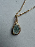 18ct gold-plated silver teardrop necklace with light blue topaz