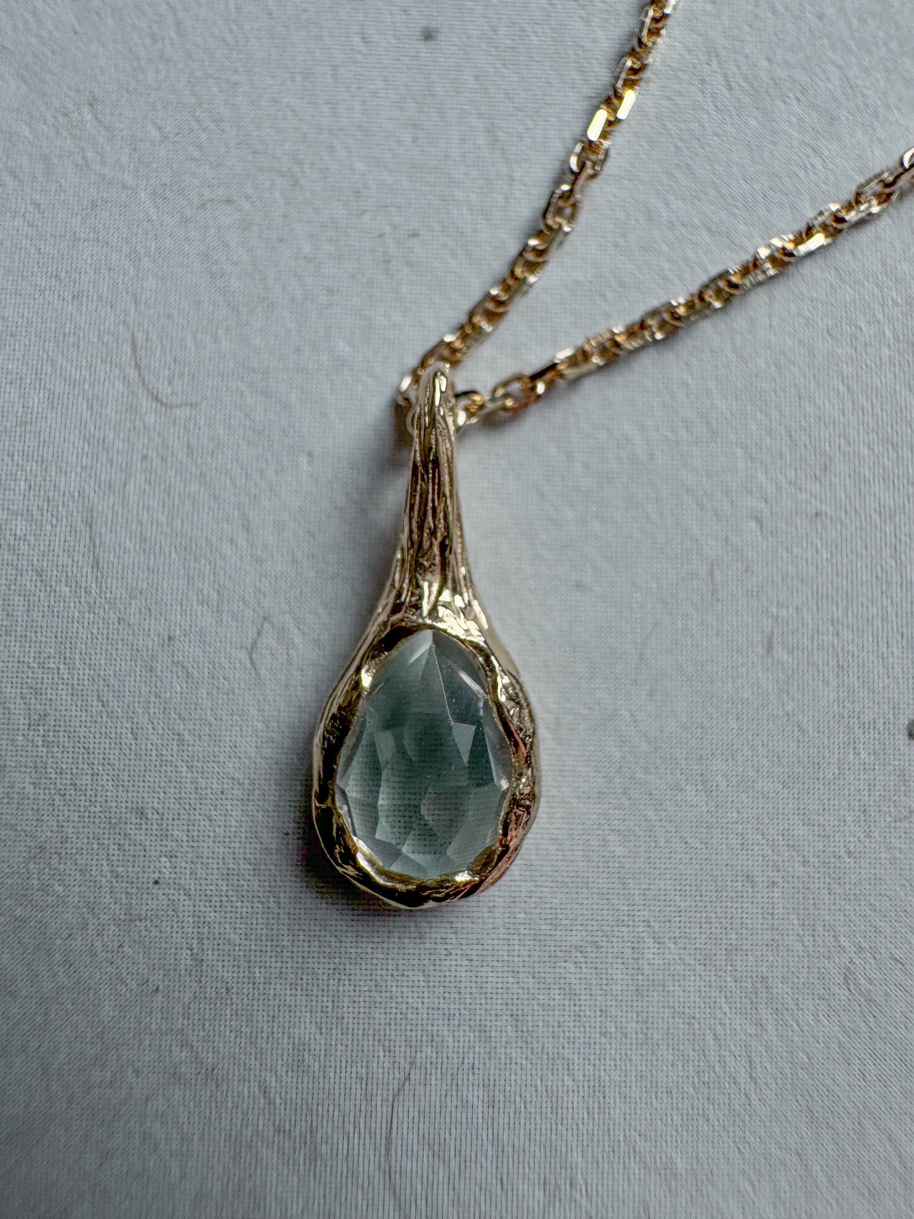 18ct gold-plated silver teardrop necklace with light blue topaz