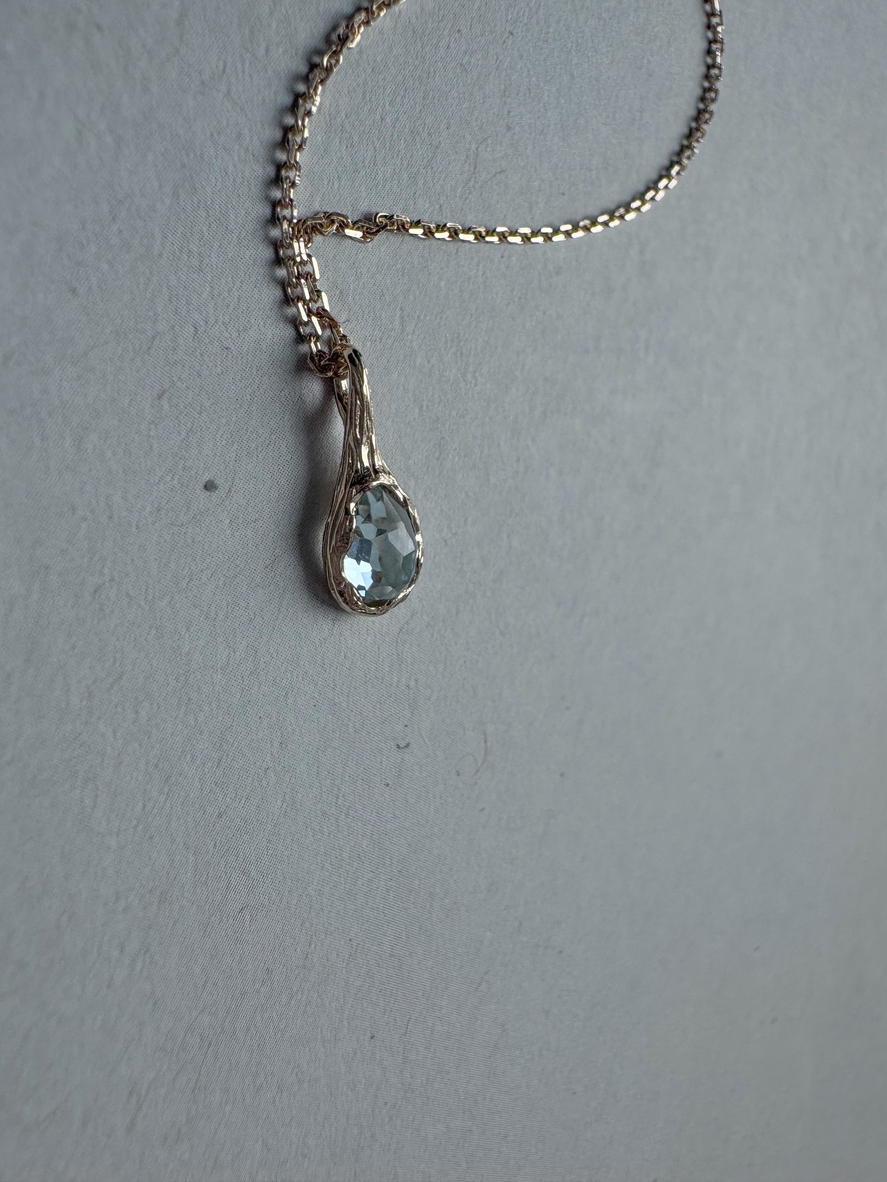 18ct gold-plated silver teardrop necklace with light blue topaz