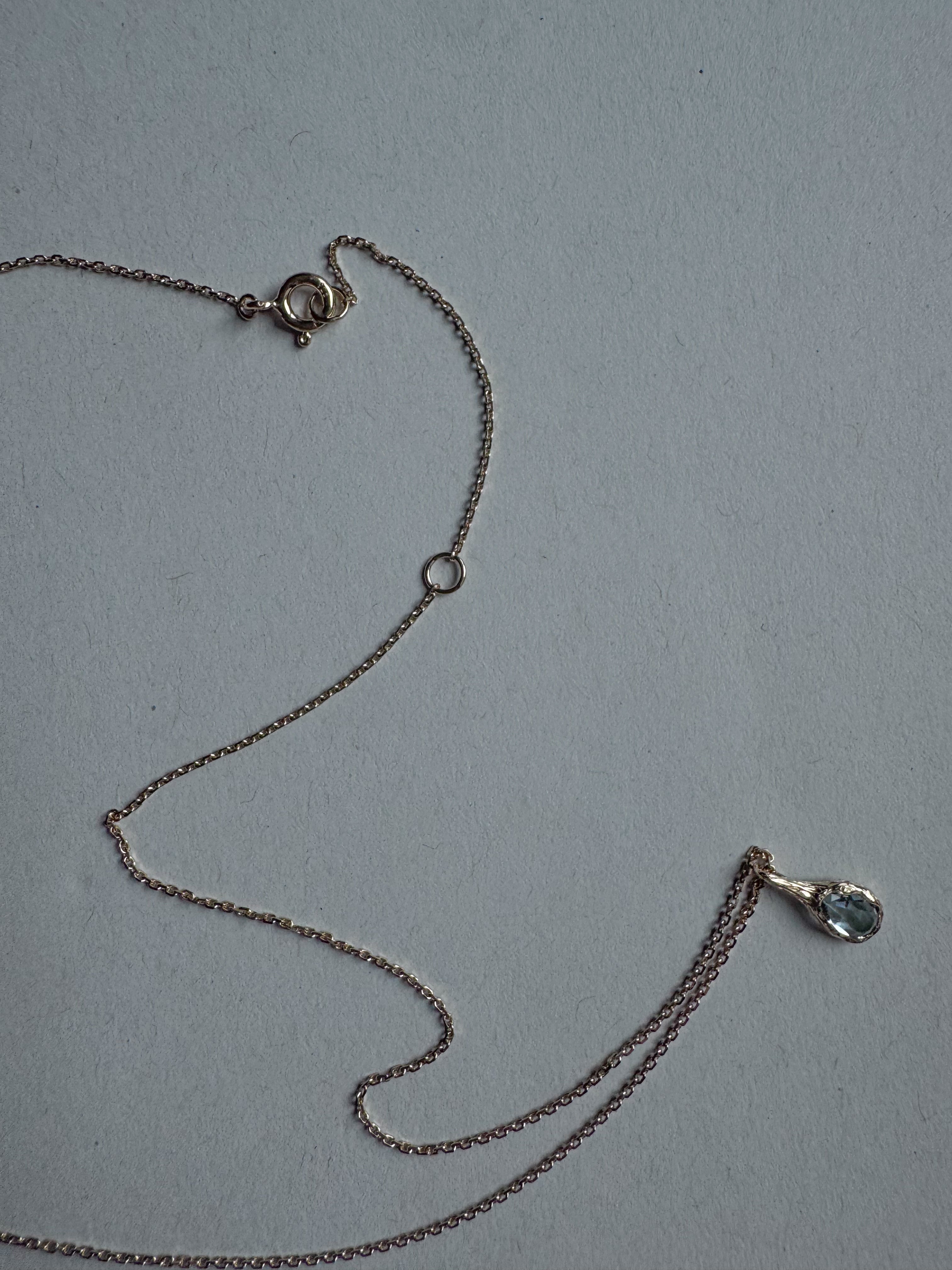 18ct gold-plated silver teardrop necklace with light blue topaz