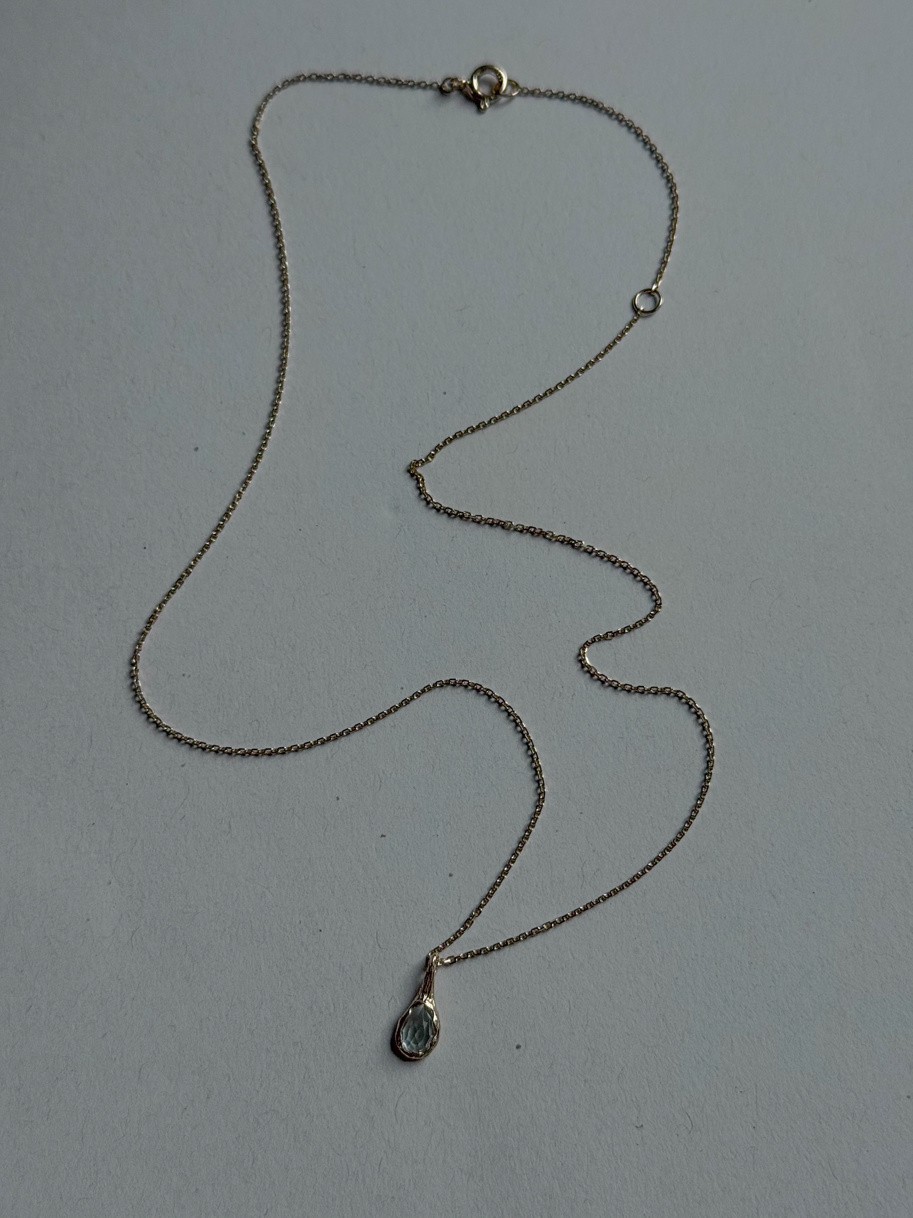 18ct gold-plated silver teardrop necklace with light blue topaz