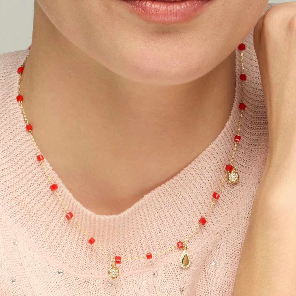 Gold-finish sterling silver necklace with red crystal beads and cubic zirconia pavé charms
